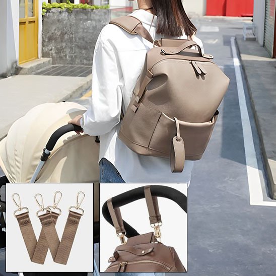 sac à dos à langer peut etre attaché sur poussette