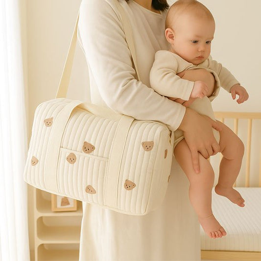 Sac a langer bebe biege porté sur maman avec un bébé
