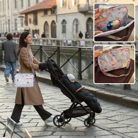 Sac a langer gris à motif porté sur maman qui pousse son bébé poussette