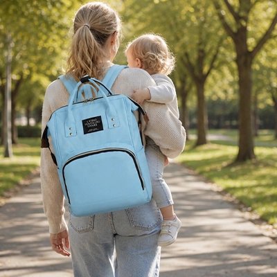 Sac à dos à langer maman au parc